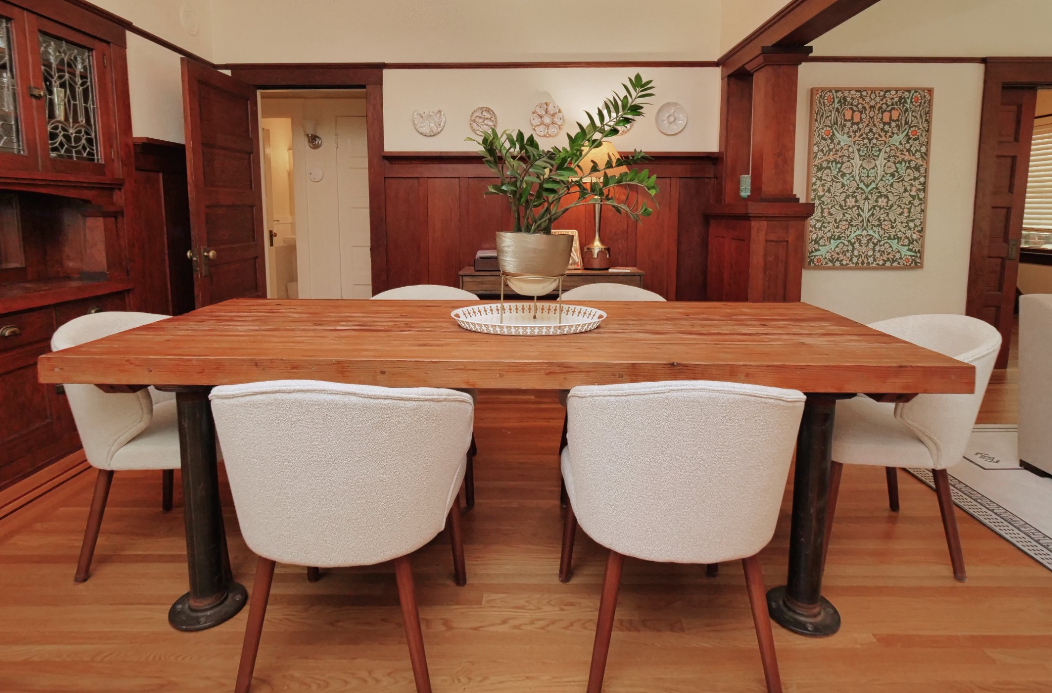 Craftsman dining room with a wooden table, upholstered chairs, and original built-ins