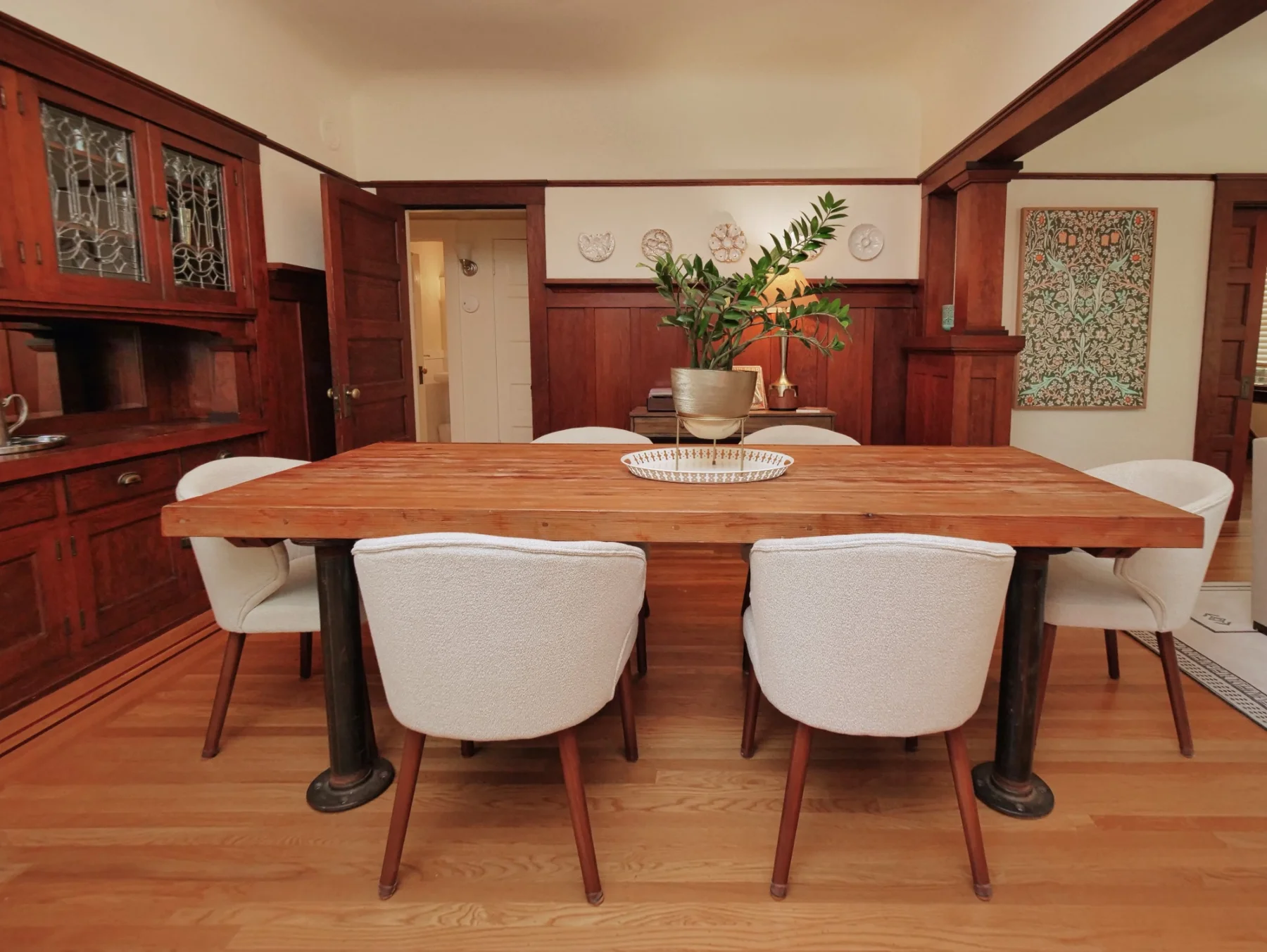 Bentley dining room with a table for gathering and original Craftsman built-ins