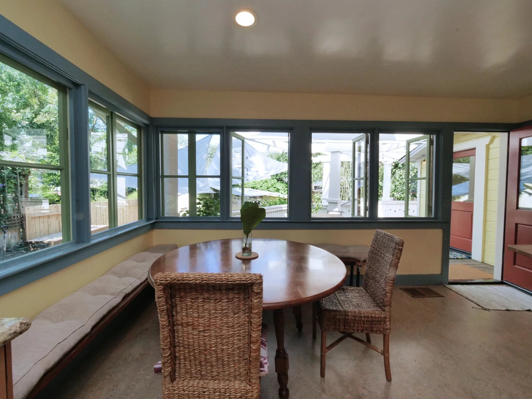 Bright Main Floor breakfast nook surrounded by windows