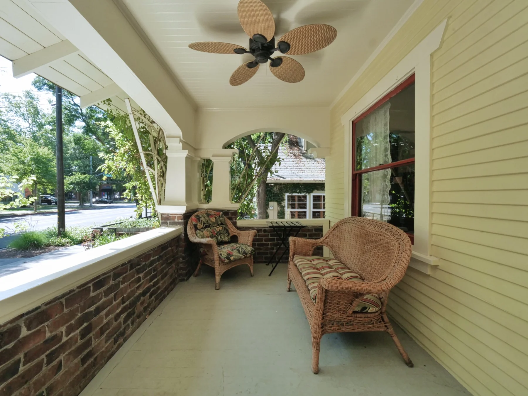 Front porch seating overlooking the leafy Davis neighborhood